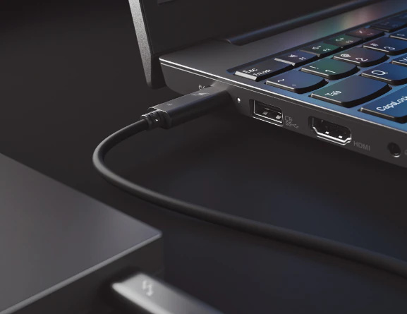 Closeup of power cable plugged into black Lenovo ThinkPad E15 Gen 2 Thunderbolt port 